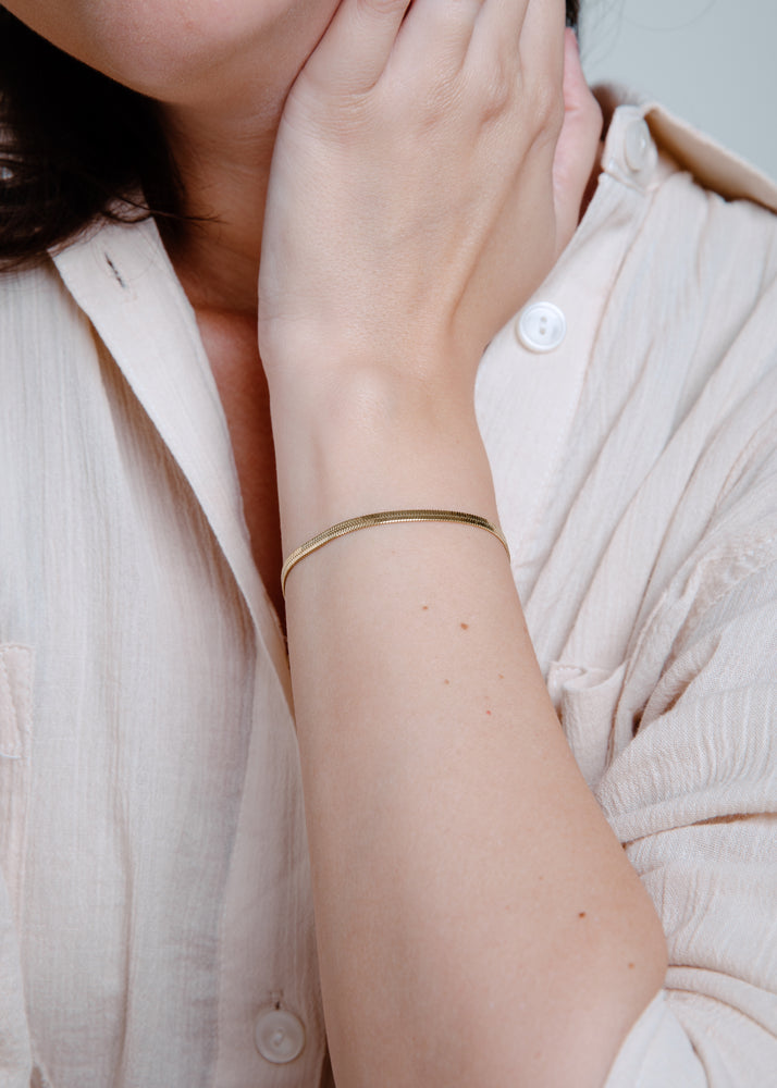 
                  
                    Gold Snake Bracelet
                  
                